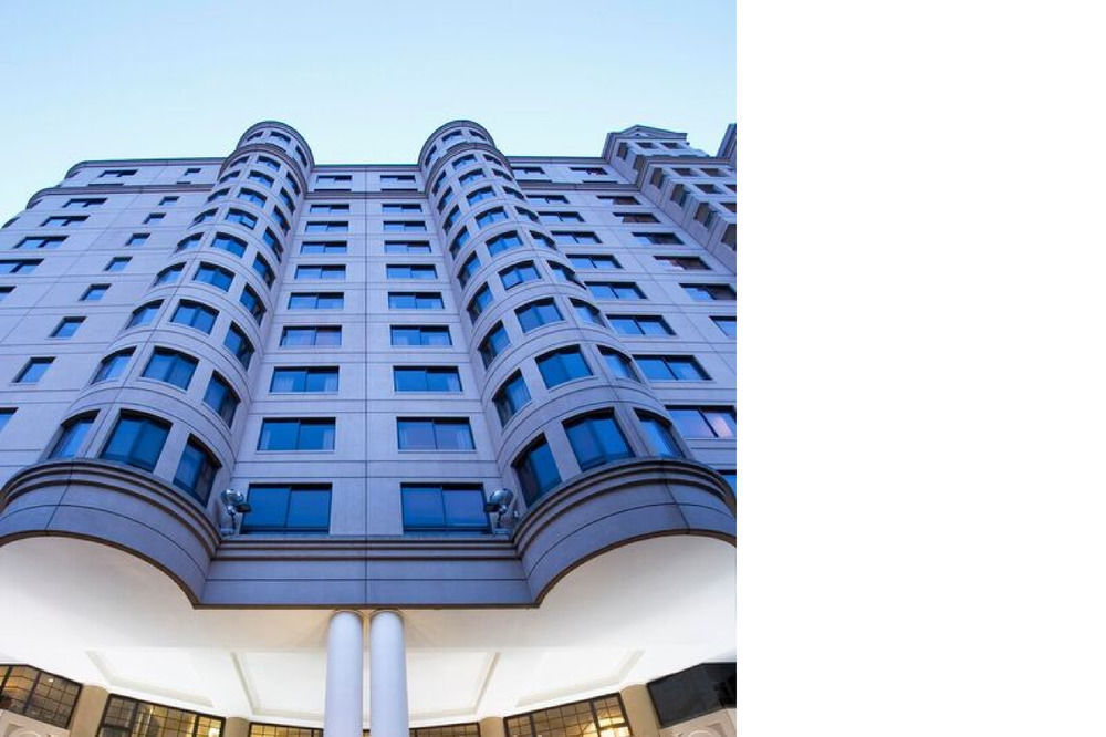 Stamford Grand Adelaide Hotel Glenelg Exterior photo The photo shows a modern building with a distinct architectural design. The structure has multiple stories, featuring a series of rounded balconies and large windows that provide a sleek, contemporary look. The entrance is highlighted by a canopy sup